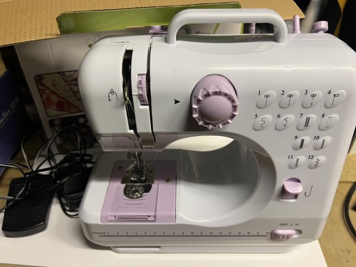 Sewing machine with foot pedal - sewing,